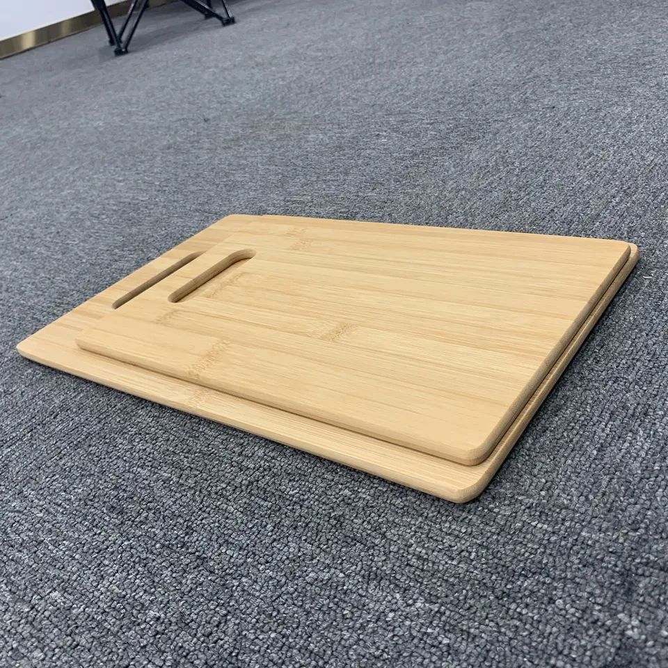 Set of two bamboo chopping boards with holes