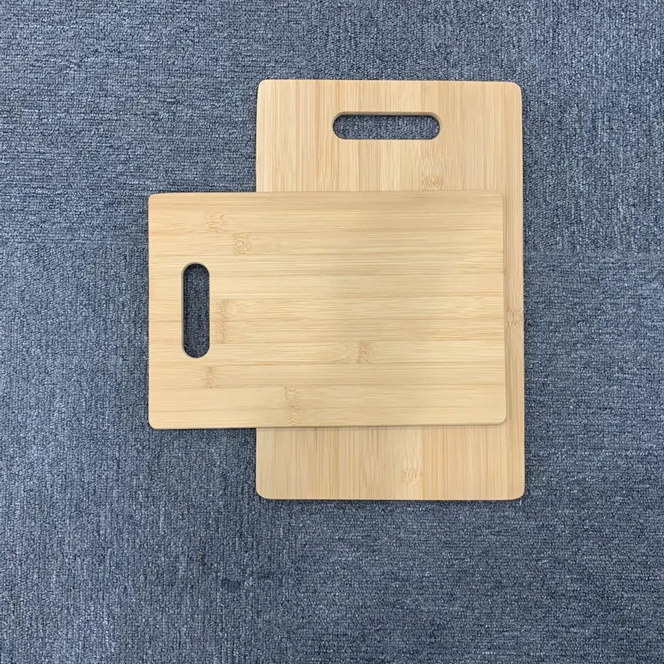 Set of two bamboo chopping boards with holes