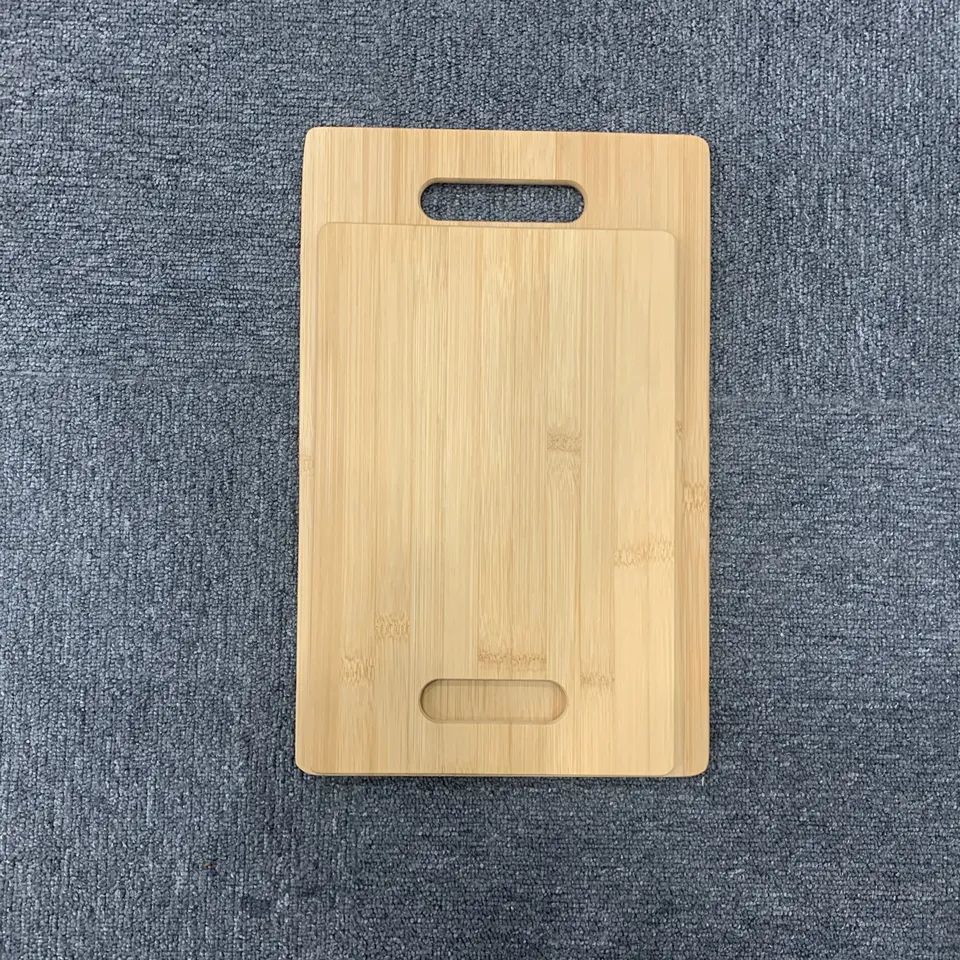 Set of two bamboo chopping boards with holes